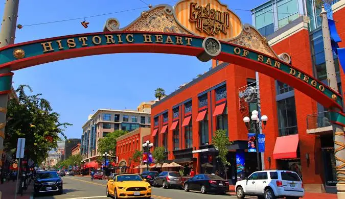 Victorian-era buildings lit up at night along Fifth Avenue in San Diego's Gaslamp Quarter entertainment district